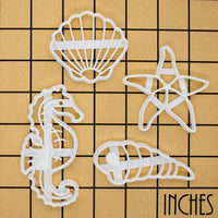 set of 4 cookie cutters, featuring a seashell, a seahorse, a corkscrew and a starfish
