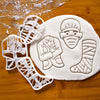 set of 3 doctor themed cookie cutters, includes a leg cast, surgeon face and a doctor's coat.