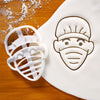 surgeon face in mask cookie cutter pressed on white fondant