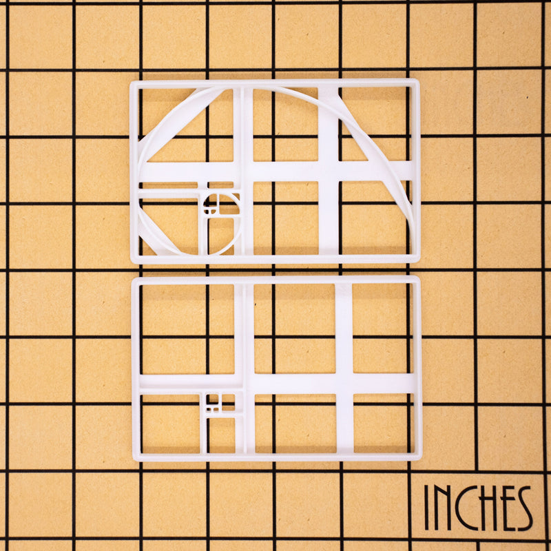 set of 2 golden ratio cookie cutters, featuring a fibonacci spiral and fibonacci tiling