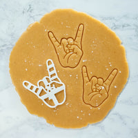 bakerlogy hand sign rock cookie cutter with dough cut outs