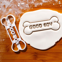 GOOD BOY Dog Bone Cookie Cutter pressed on white fondant icing to show imprints - Bakerlogy