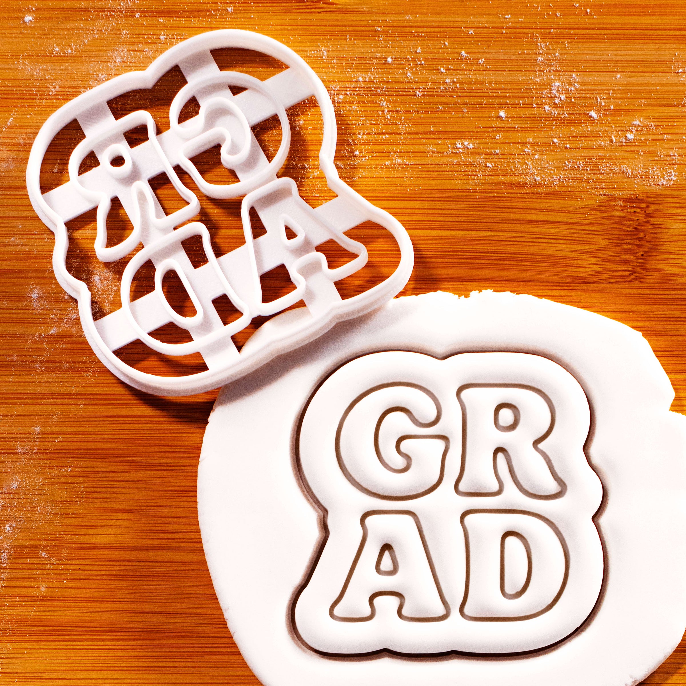 GRAD in Block Letters