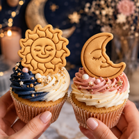 Celestial sun and crescent moon cookies used as cupcake toppers for a boho celestial party
