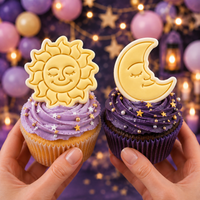 Celestial sun and moon fondant cupcake toppers on purple celestial party cupcakes