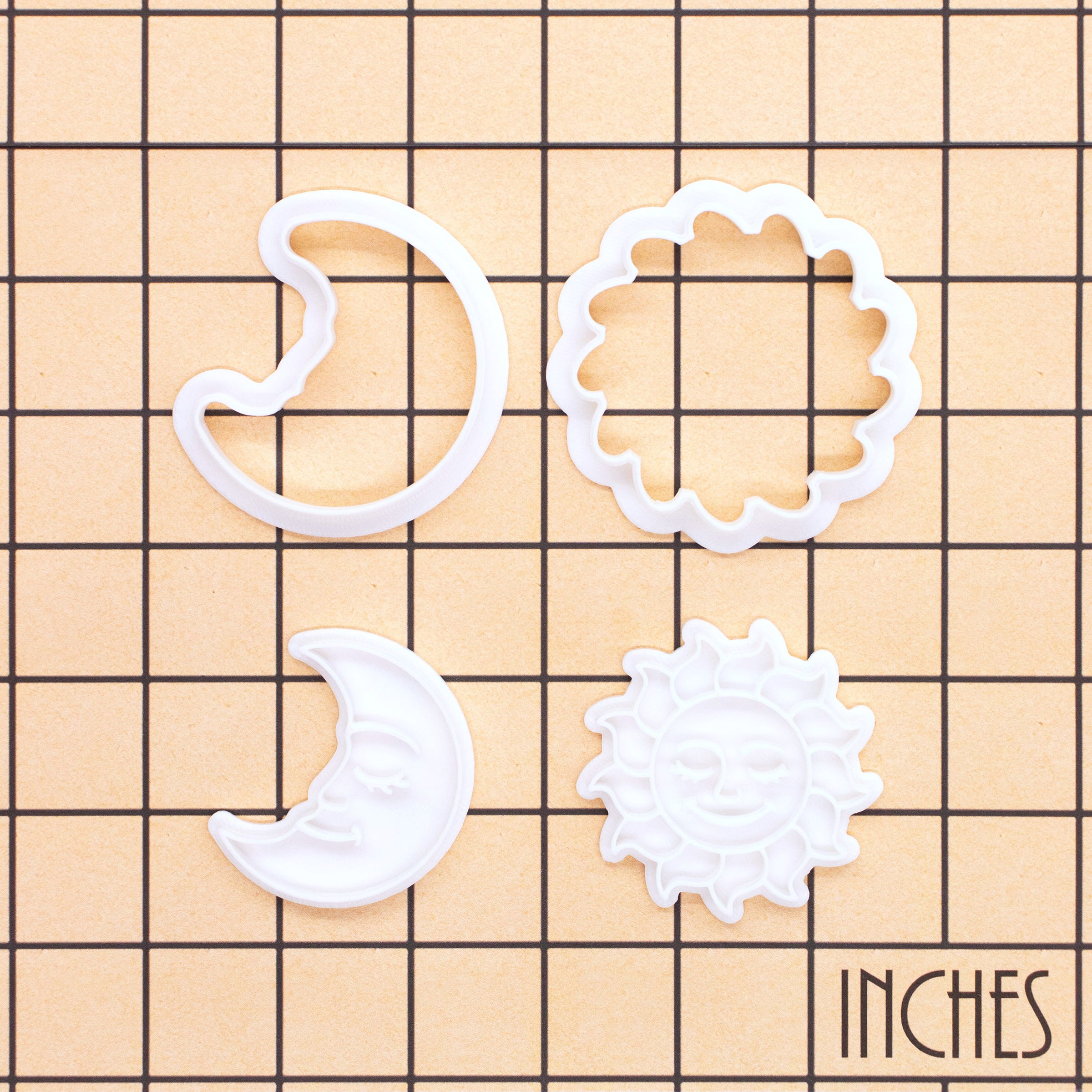 Celestial Sun and Moon Mini Cookie Cutter & Stamp Sets shown on inch measurement grid