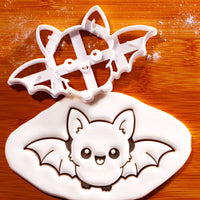 Flying Chibi Bat Cookie Cutter with stamped bat design in fondant for Halloween baking