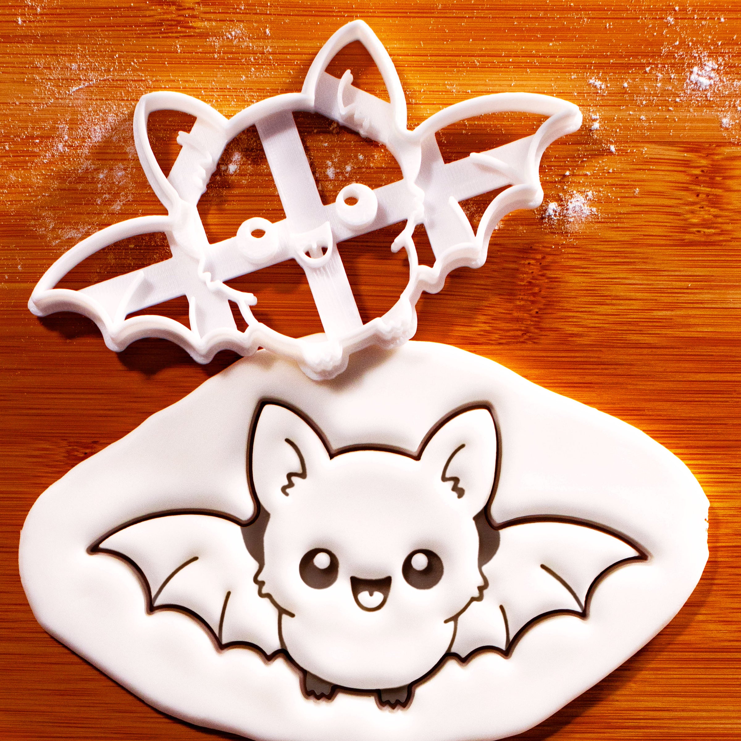 Flying Chibi Bat Cookie Cutter with stamped bat design in fondant for Halloween baking