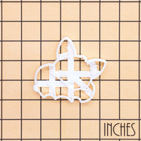 Sleeping Chibi Bat Cookie Cutter shown on an inch measurement grid for size reference