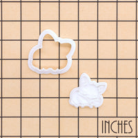 Sleeping Chibi Bat Mini Cookie Cutter and separate stamp shown on an inch measurement grid for size reference