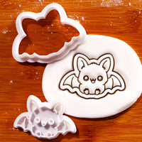 Sitting chibi bat mini cookie cutter and stamp with kawaii embossed bat design in fondant