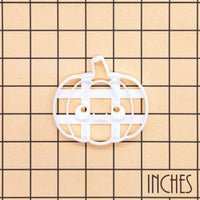 Kawaii pumpkin cookie cutter shown on an inch measurement grid