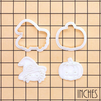 Witchy spider and pumpkin mini cookie cutter and stamp set on an inch grid