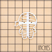 Chibi mummy cookie cutter on an inch measurement grid
