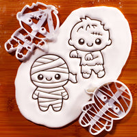 Set of 2 chibi mummy and zombie Halloween cookie cutters with stamped fondant designs