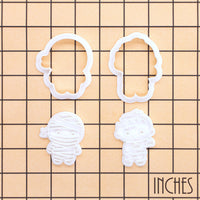 Chibi mummy and zombie mini cookie cutter and stamp sets on inch measurement grid