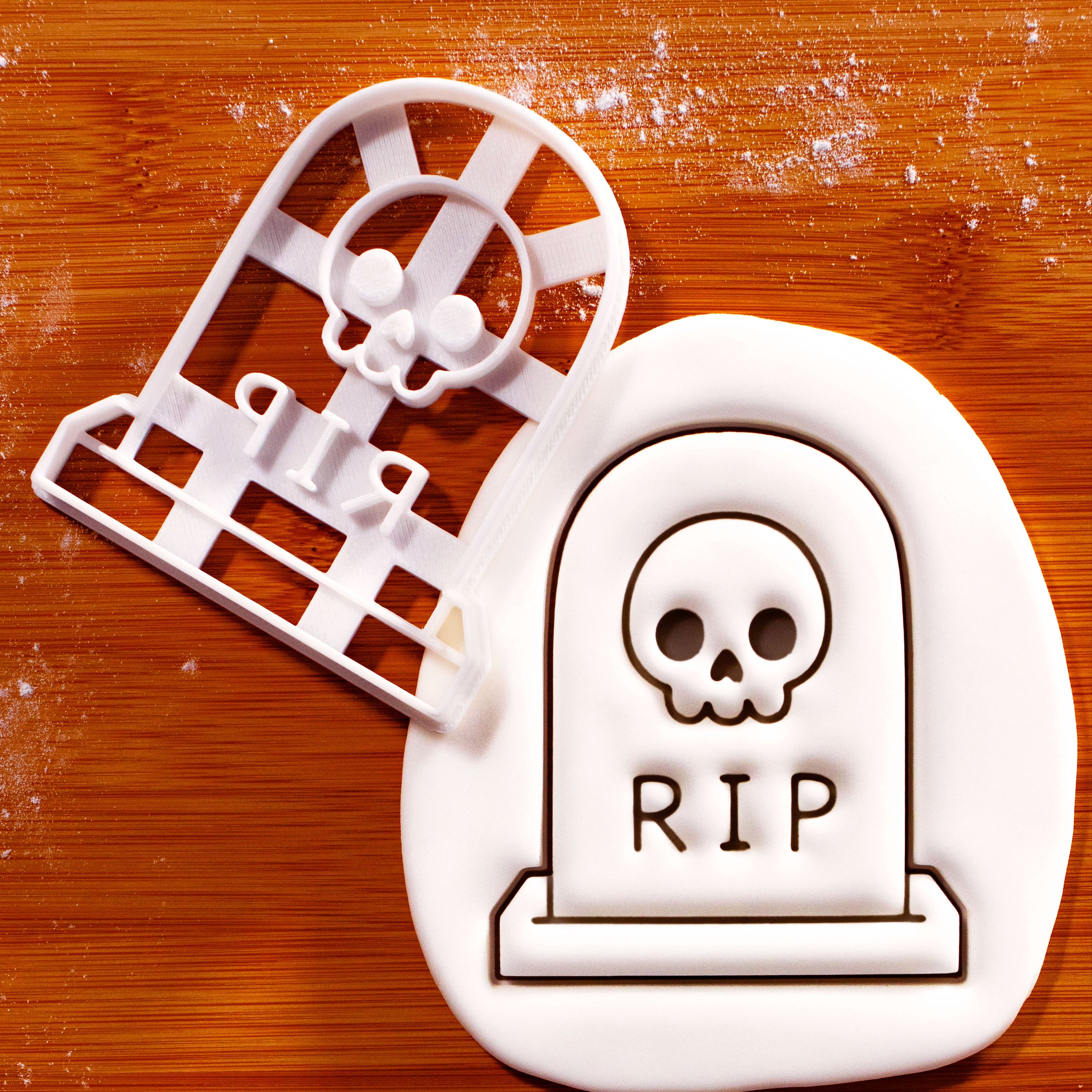 RIP Tombstone with Skull cookie cutter beside embossed fondant showing skull and RIP details
