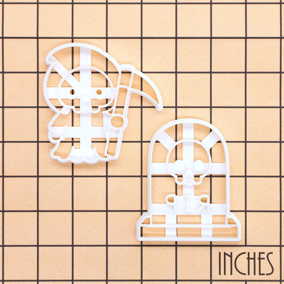 Grim Reaper and RIP Tombstone with Skull Halloween cookie cutters shown on inch measurement grid