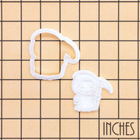 Kawaii Grim Reaper mini cookie cutter and separate impression stamp shown on inch measurement grid