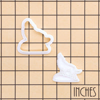 Howling Wolf mini cookie cutter and matching stamp shown on inch measurement grid