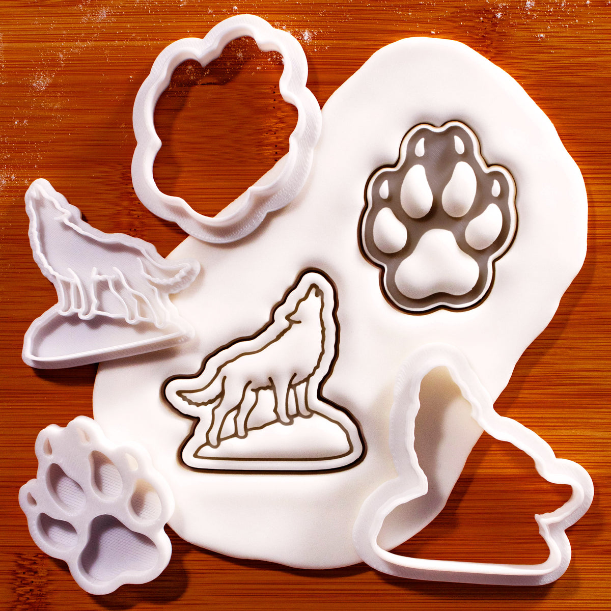 Howling Wolf and Wolf Paw Print mini cookie cutter and stamp set with fondant impressions