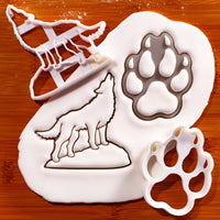 Howling wolf and wolf paw print cookie cutters with detailed fondant impressions