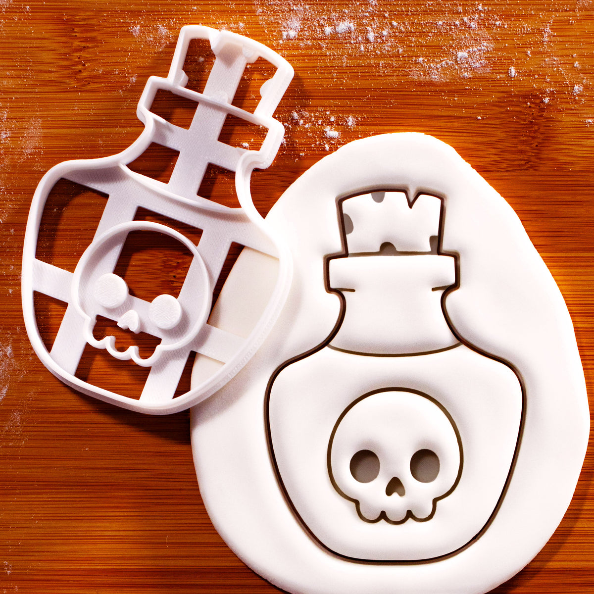 Kawaii poison potion Halloween cookie cutter with skull bottle fondant impression