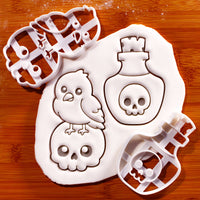 Kawaii raven on skull and poison potion Halloween cookie cutters with fondant impressions