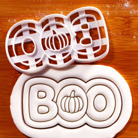 BOO pumpkin Halloween cookie cutter with embossed pumpkin lettering shown in rolled fondant