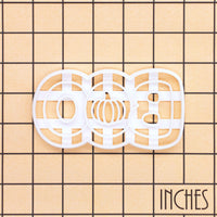 BOO pumpkin cookie cutter shown on an inch measurement grid