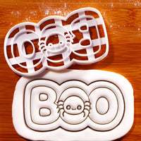 BOO spider cookie cutter with embossed Halloween fondant showing cute spider and BOO lettering