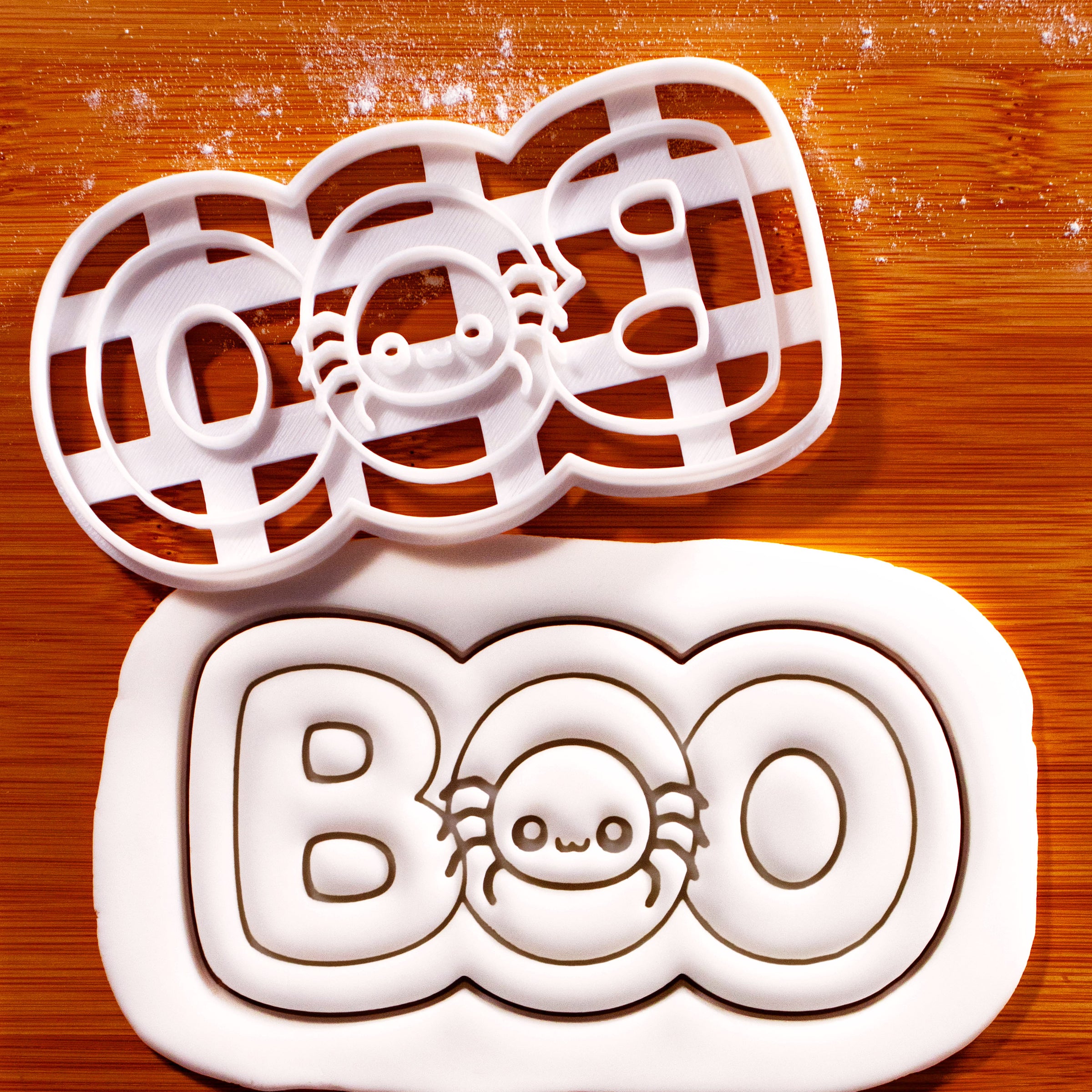BOO spider cookie cutter with embossed Halloween fondant showing cute spider and BOO lettering
