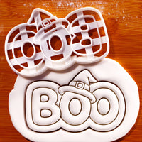 BOO witch hat Halloween cookie cutter beside detailed BOO fondant impression with witch hat and buckle