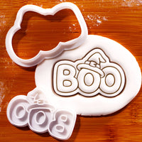 BOO witch hat mini cookie cutter and separate stamp beside detailed fondant impression