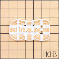 BOO cat face cookie cutter shown on inch measurement grid for size reference