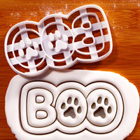 BOO Paw Print Cookie Cutter creating bold BOO lettering with two paw print impressions in rolled fondant
