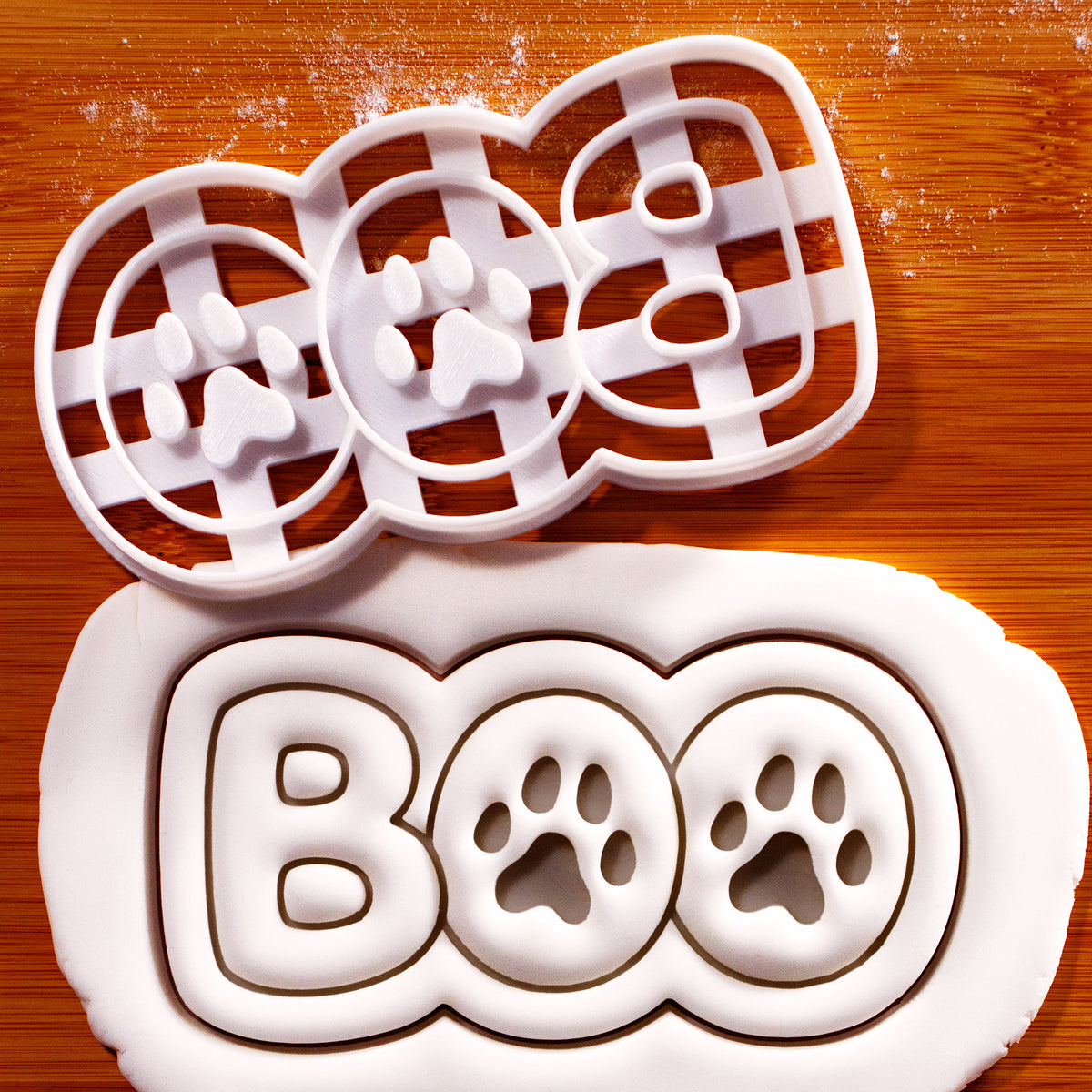 BOO Paw Print Cookie Cutter creating bold BOO lettering with two paw print impressions in rolled fondant