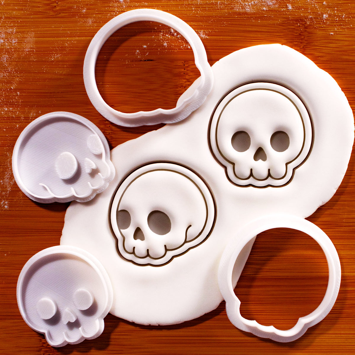 Front & side view cute skull mini cutter and stamp set with fondant impression on wooden board
