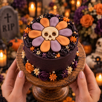 Daisy Skull fondant cake topper on purple gothic Halloween cake with orange flowers