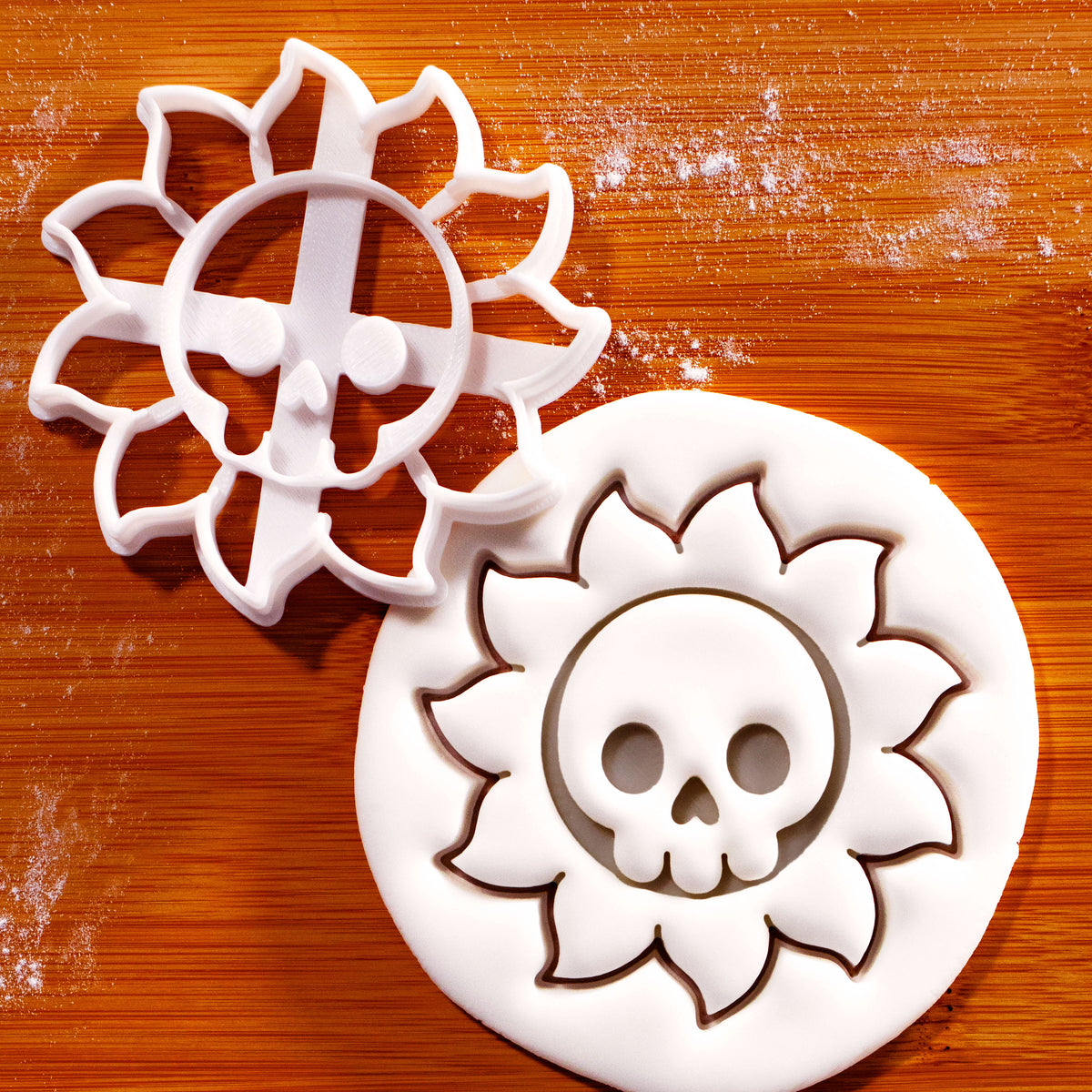 Skull Sun cookie cutter with skull and sunshine ray impression for gothic Halloween baking