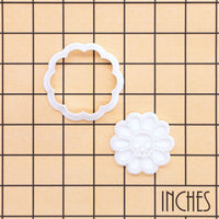 Daisy Skull Mini cookie cutter and stamp set on inch grid showing 2-piece floral skull design