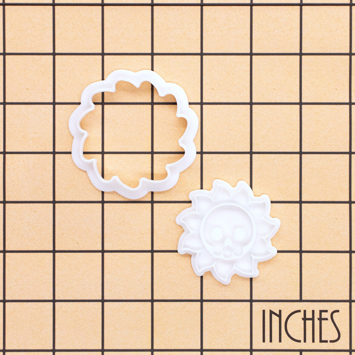 Skull Sun Mini cookie cutter and stamp set on inch grid showing 2-piece celestial skull design