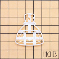 White Smiling Potion cookie cutter on inch grid for Halloween science baking