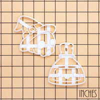 Skull with Witch Hat and Smiling Potion cookie cutter set on inch grid for Halloween baking
