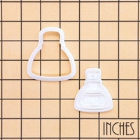 Smiling Potion mini cookie cutter and stamp set on inch grid background