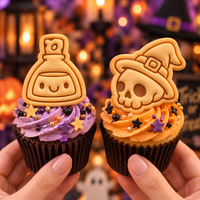 Skull Witch Hat and Smiling Potion mini cookie toppers on Halloween cupcakes