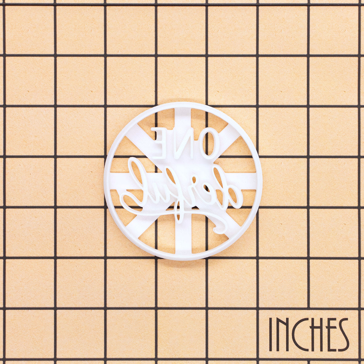 ONEderful cookie cutter on inch grid for first birthday baking
