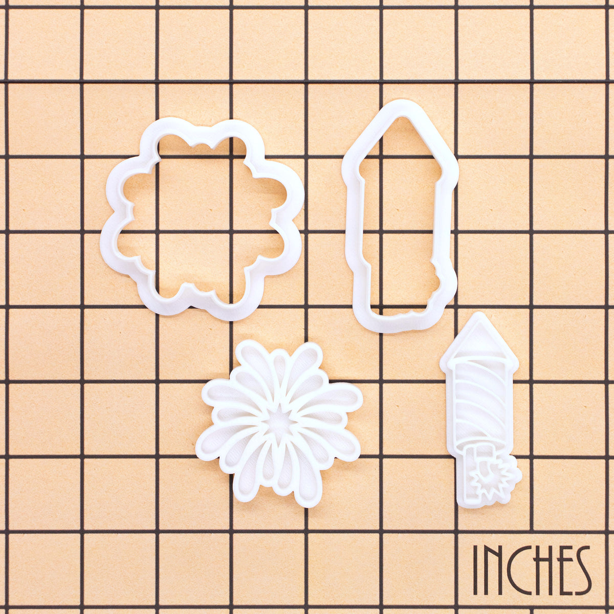 Starburst and Rocket Firework mini cookie cutter and stamp set on inch grid