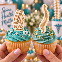 Lumbar and spine cookie toppers on anatomy cupcakes with healthcare decor