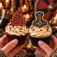 Decorated Viking cupcakes with red Valknut topper and blue gold Mjolnir topper for Norse mythology parties